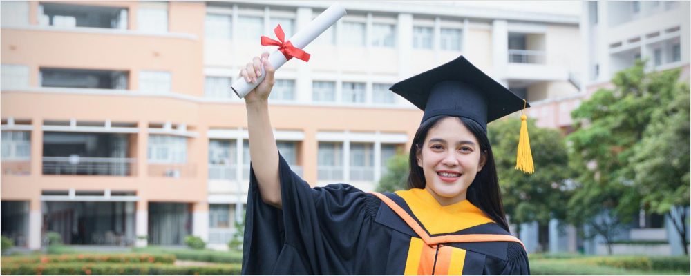 group diverse grads throwing caps up sky 10